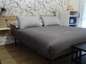 Ένα ή περισσότερα κρεβάτια σε δωμάτιο στο Cà del corso