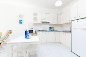 Kuchyň nebo kuchyňský kout v ubytování Apto 2 Almoraide Suites