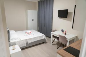 Ένα ή περισσότερα κρεβάτια σε δωμάτιο στο MyRoom