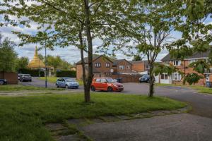 a group of cars parked in a parking lot at Lakeside Nook Garden Parking 4 people in Birmingham