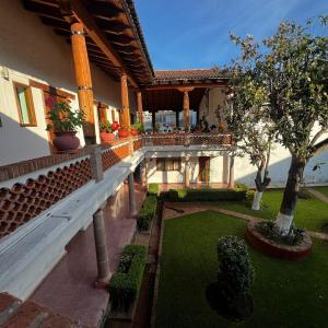 an external view of a building with a garden at Calli Yoloiztac in Cedro
