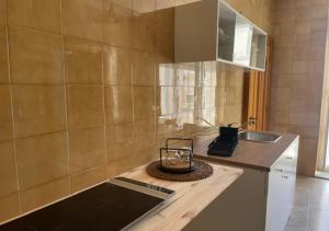a kitchen with a counter top with a sink and a counter sidx sidx at dimora virginia in Matera +56 photos