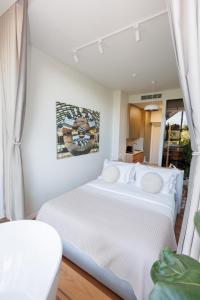 Ένα ή περισσότερα κρεβάτια σε δωμάτιο στο Retreat Apartments