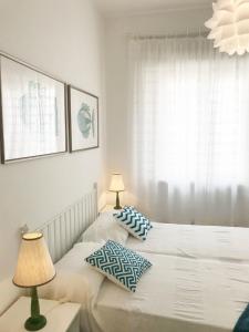 Voodi või voodid majutusasutuse Helle Wohnung In Castiglione Della Pescaia toas