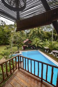 a view from the balcony of a resort with a swimming pool at Fundo Baños in Tarapoto
