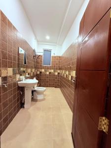 a bathroom with a toilet and a sink at Blooming Residences by Gold Mark Property Consultants in Nugegoda