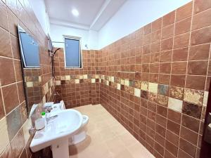 a bathroom with a toilet and a sink at Blooming Residences by Gold Mark Property Consultants in Nugegoda
