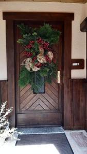 a door with a christmas wreath on it at Bergnest in Bad Gottleuba
