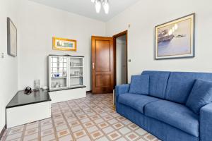 Et opholdsområde på Hostdomus - Oasi Apartment free garage