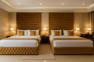 Una cama o camas en una habitación de The Ginger- A Four Star Luxury Hotel In Dharamshala # Centrally Heated & Air Cooled # Premium Rooms # Lift # Bar # Terrace # Big Parking # Near market # Top Rated # Property of the year # By royal castle #