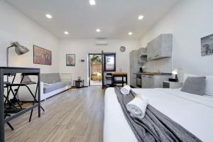 Giường trong phòng chung tại A Casa di Stefano by Domus&Dimore