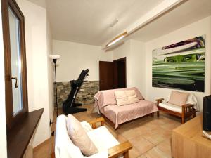 a living room with a couch and a chair at Lakefront with garden in Oria