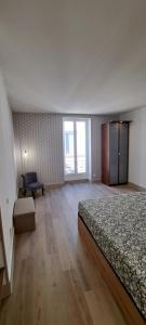 Ένα ή περισσότερα κρεβάτια σε δωμάτιο στο Le Chapelier - Appartement dans l'éccuson