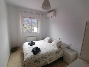 Ένα ή περισσότερα κρεβάτια σε δωμάτιο στο Guejar Sierra House with Spectacular Views