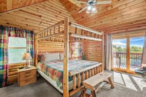 a bedroom with a bunk bed in a log cabin at Sugar Bear Lodge in Banner Elk