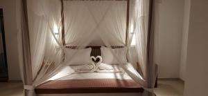 En eller flere senge i et værelse på Green Serene Villa