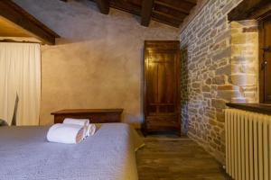 Ένα ή περισσότερα κρεβάτια σε δωμάτιο στο Borgofortino