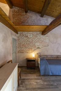 Ένα ή περισσότερα κρεβάτια σε δωμάτιο στο Borgofortino