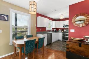 a kitchen with a table and a dining room at Beach Breeze West in Bradenton Beach