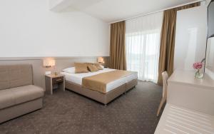 Postel nebo postele na pokoji v ubytování Hotel Jadran Neum