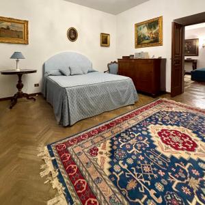 a bedroom with a bed and a rug at Castello Vinci - Dimora di Charme in Vetralla
