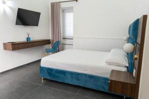 Ένα ή περισσότερα κρεβάτια σε δωμάτιο στο Carotenuto Palace