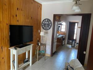 a living room with a flat screen tv on a wall at Casa en zona centro in Necochea