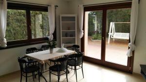 a dining room with a table and chairs and a patio at Ferienhaus In Pedruscada Mit Privatem Pool in Cala Ratjada +31 photos