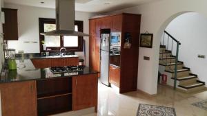 a kitchen with a sink and a stove top oven at Ferienhaus In Pedruscada Mit Privatem Pool in Cala Ratjada