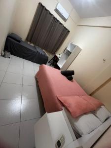 a small room with a bed and two boxes at ORLA FLAT - Apartamento 02 in Bragança