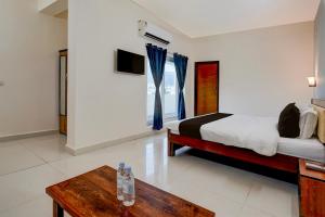 Voodi või voodid majutusasutuse Hotel O Peram INN toas