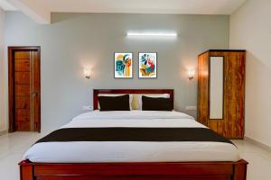 Voodi või voodid majutusasutuse Hotel O Peram INN toas