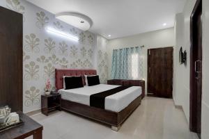 Postel nebo postele na pokoji v ubytování Hotel O UR wish