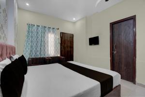 Postel nebo postele na pokoji v ubytování Hotel O UR wish + 21 fotografií