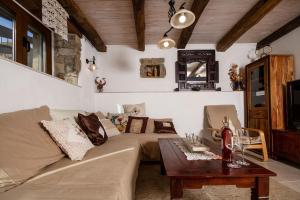 a living room with a couch and a table at Villa Casa Sarina in Brdo