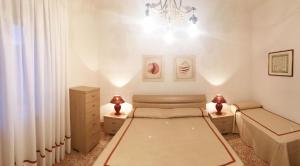 Voodi või voodid majutusasutuse Gemütliche Wohnung In Castiglione Della Pescaia toas