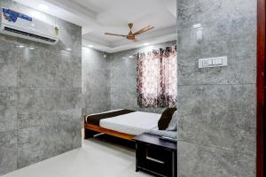 Voodi või voodid majutusasutuse Collection O Karumariamman Temple Thiruverkadu Formerly Sridevi Residency toas +22 fotot