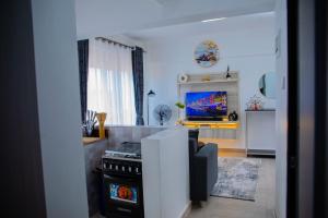 TV a/nebo společenská místnost v ubytování Bukoto + 7 fotografií