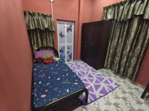 Postel nebo postele na pokoji v ubytování Homestay ujang + 9 fotografií