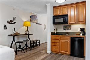 a kitchen with a sink and a counter top at Timbers Studio 14 with Wintergreen Advantage in Wintergreen