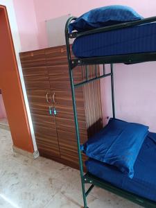 Ένα ή περισσότερα κρεβάτια σε δωμάτιο στο Le Apex Hostel