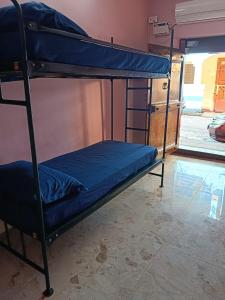 Ένα ή περισσότερα κρεβάτια σε δωμάτιο στο Le Apex Hostel