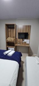 Ένα ή περισσότερα κρεβάτια σε δωμάτιο στο Hotel Querência