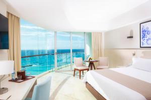 Ένα ή περισσότερα κρεβάτια σε δωμάτιο στο Altitude at Krystal Grand Cancun - All Inclusive +69 φωτογραφίες
