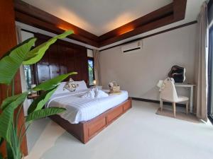 Postel nebo postele na pokoji v ubytování Kaya Mani Villas