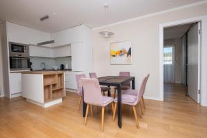 a kitchen and dining room with a table and chairs at Sanja & Mirza Apartments - Old Town Sarajevo in Sarajevo +74 photos