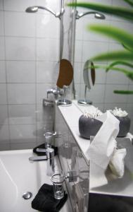 a bathroom with a sink and a mirror at Hotel Dunza in Bürserberg