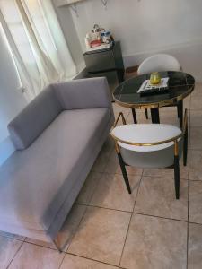 a living room with a couch and a table at Blue Sail Apartments in Simpson Bay