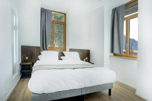 Voodi või voodid majutusasutuse Auberge de Morcles toas