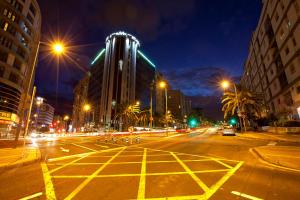 a city street at night with buildings and street lights at Silken Atlántida Santa Cruz in Santa Cruz de Tenerife